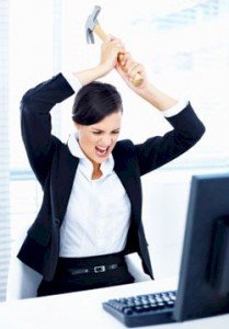 an-irrate-woman_hammering_ her_laptop
