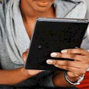 someone using a tablet for m-commerce